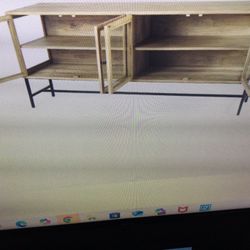 TV STAND FOR UP TO 85 INCH HIGH END MERCANA ARELIUS… 70X18X32H LIGHT TAN WOOD…MISSING TWO SIDE GLASSES NO BIG DEAL RETAILS AT 1795 PLUS TAX