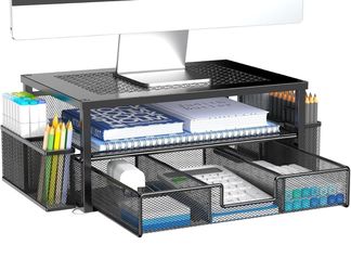 Sturdy black mesh monitor stand with a sliding drawer for office organization.