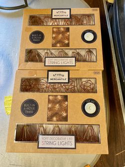 Studio Mercantile branded 10ft decorative LED string lights featuring geometric, diamond-shaped metal cages in a rose gold finish.