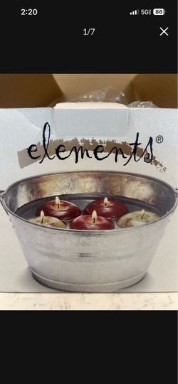 Decorative Bobbing candle apples in a bucket