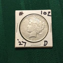 1927 D PEACE SILVER DOLLAR.