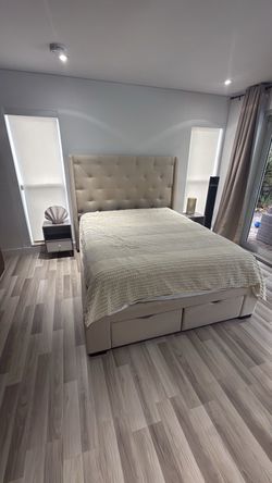 Queen  bed with two night stands