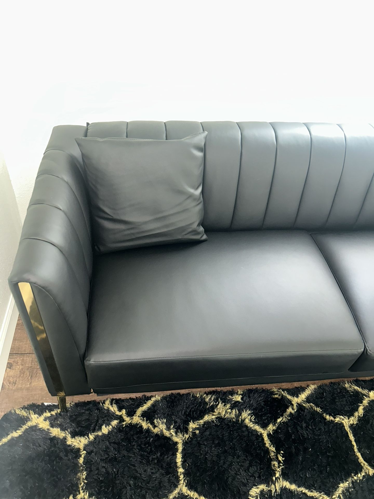 Black faux leather couch