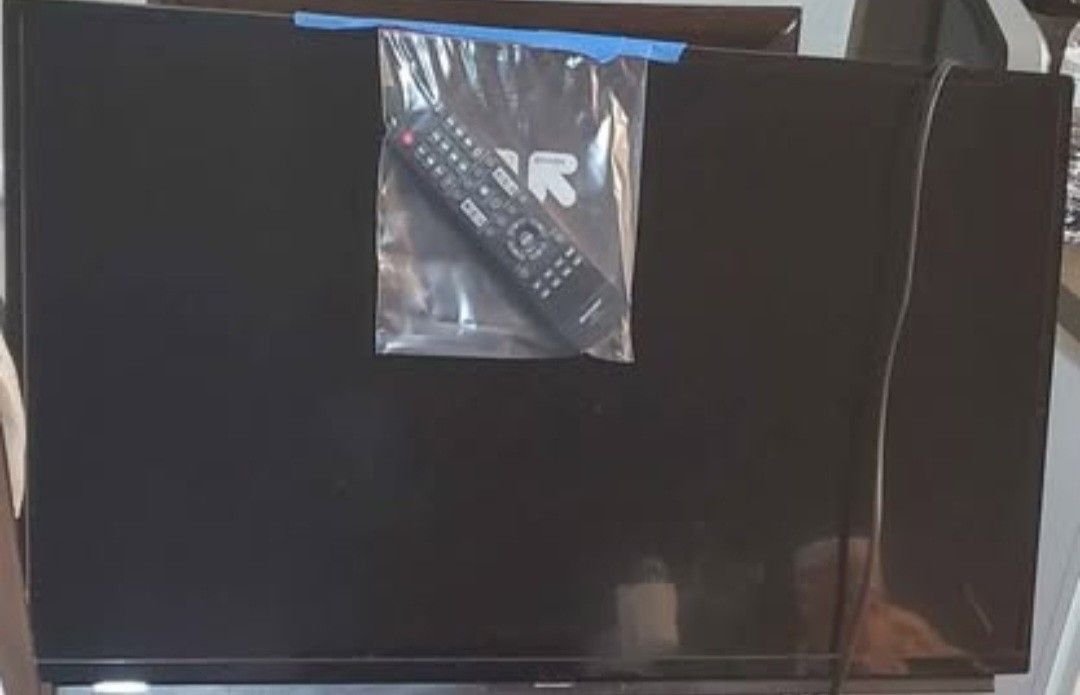 Like New 24 Inch Sharp Flat Screen Tv With Remote And Stand.