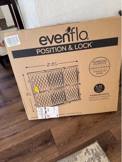 Two Evenflo position and lock gate