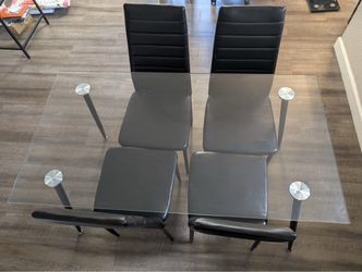Glasstop dining table set with 4 chairs