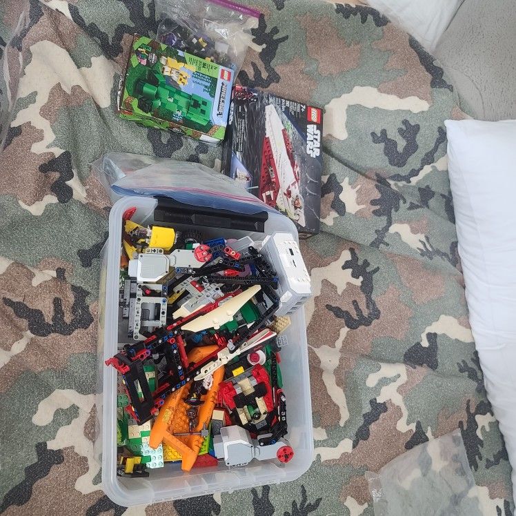 Box Of Legos With Minifigs And Instructions