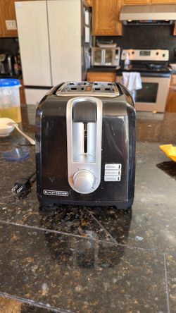 BLACK+DECKER® 2-slice toaster includes a browning knob, extra-wide slots, bagel mode, a cancel option, and a crumb tray