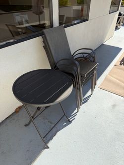 Outdoor bistro Set – 4 Stackable Chairs + Folding Table