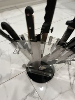 Kitchen knives holder with different knives and more item, the holder is from bed bath and beyon