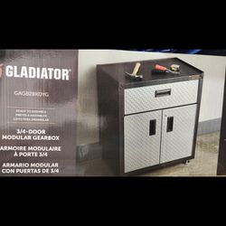   Brand New   Gladiator Ready-to-Assemble 3/4 Door GearBox Steel Freestanding Garage Cabinet in Gray (28-in W x 31-in H x 18-in D) Price Is Firm. 
