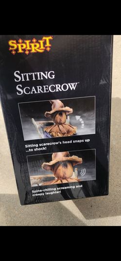 Spooky sitting Scarecrow
