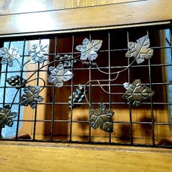 Beautiful Coffee Table with wrought iron grapes.