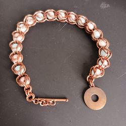 Handmade copper wire-wrapped bracelet featuring soft aqua gemstone beads...
