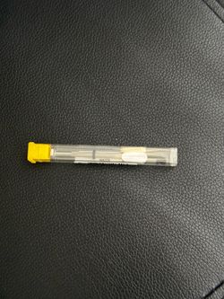 mini eyeglass repair kit featuring a screwdriver in a clear tube with a yellow cap.