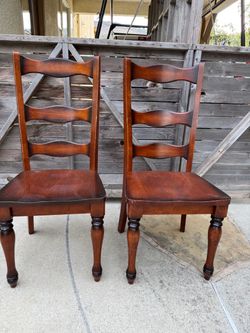 Two tall back wood dining chairs