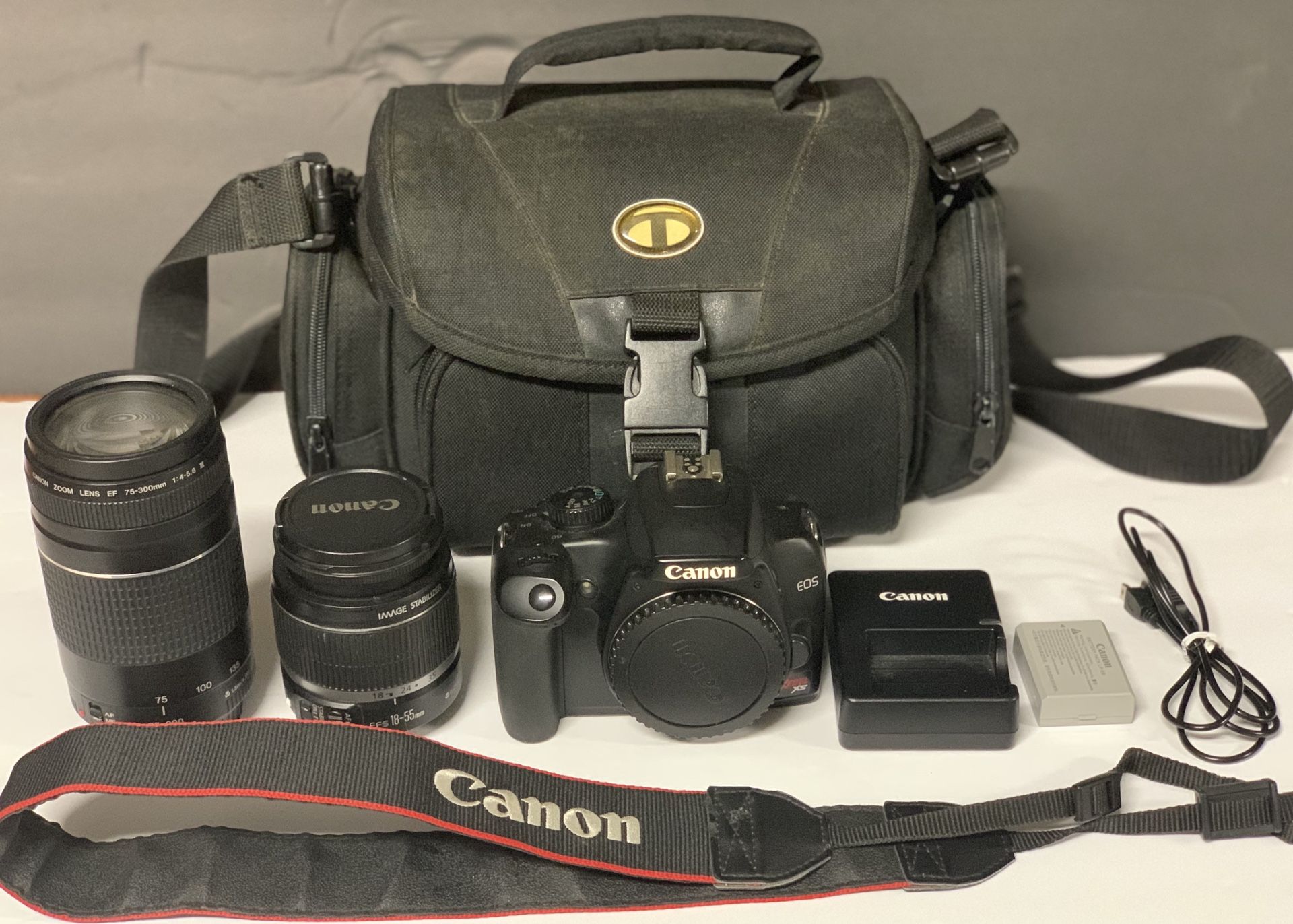 Canon Rebel XS DSLR w/ 2 Canon Lenses/Neckstrap/Battery/Charger