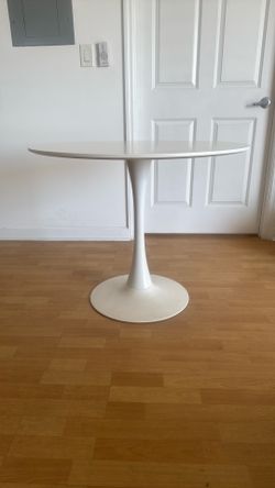 White Table and Two White Turning Chairs