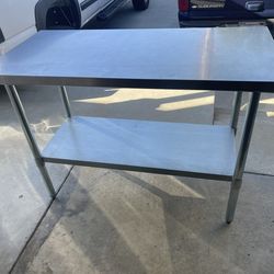 Stainless steel prep table 2’x4’ x3’