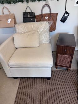 Beige couch corner and end table
