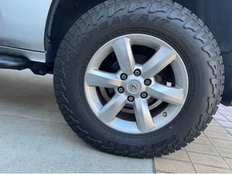 Falken Wildpeak at3w 265/70 r18 on OEM wheels, great full size spare