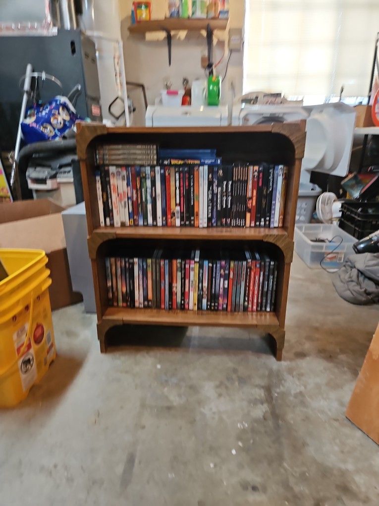 Book Shelf With DVDS and Couple Blu Ray Movies