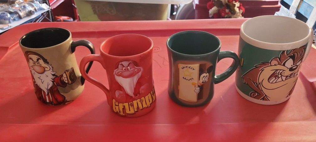 4 Mugs 3 from DISNEY STORE 1 Warner Brothers 