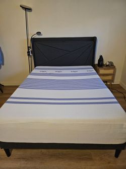 Full size memory foam with upholstered bed frame with USB ports.