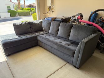 Living Spaces Sectional Sofa with 2 matching Pillows
