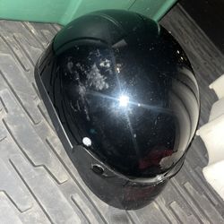 Older Skull Cap Biker Helmet And Biker Glasses 