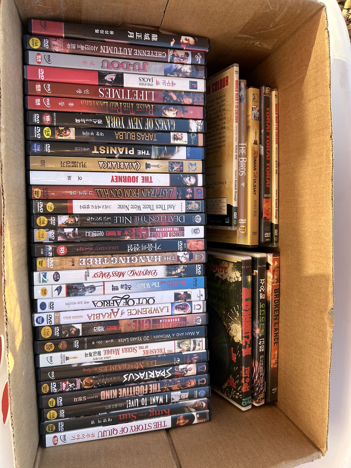 Collection of DVD cases, primarily of movies