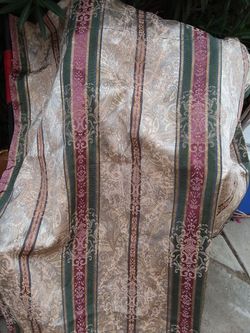 2 panels of custom made drapes, elegant material , 39 x 84 each drape. There are 2 panels