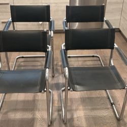 Four Vintage Mid Century Modern Black Leather Chairs