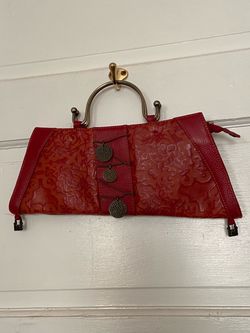 Cirque Du Soleil red metal handle clutch purse