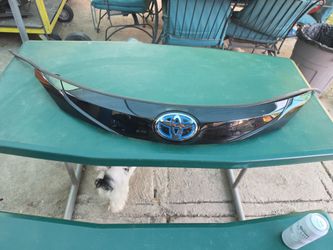 2021 TO 2025 TOYOTA SIENNA FRONT UPPER GRILLE ASSEMBLY WITH RADAR SENSOR 53101-08200 *GLOSS  BLACK OEM USED