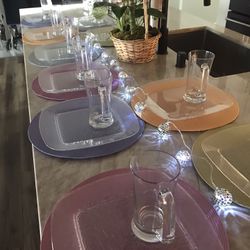 NEW, CLEAR  PLASTIC, 12 PLATES, 12 MUGS, 12 Placemats.USE INDOOR OR BY POOL/PATIO. ,PAID OVER $100.  BUY TODAY.    $35.