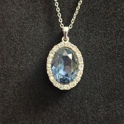 Silver-tone Pendant Necklace With Faceted Blue Crystal Surrounded By Clear Accent Stones 16" W/2" Extension
