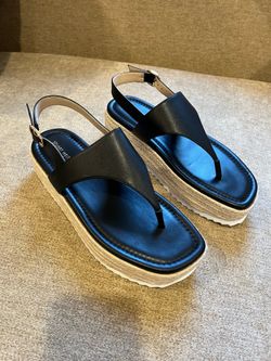 Stuart Weitzman Mel Espadrille Sandal with a black leather strap