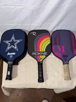 Three Pickleball Paddles
