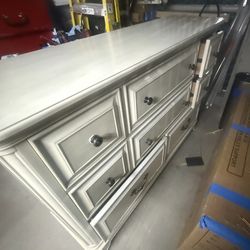 Dresser Elegant vintage dresser with multiple drawers and classic handles.