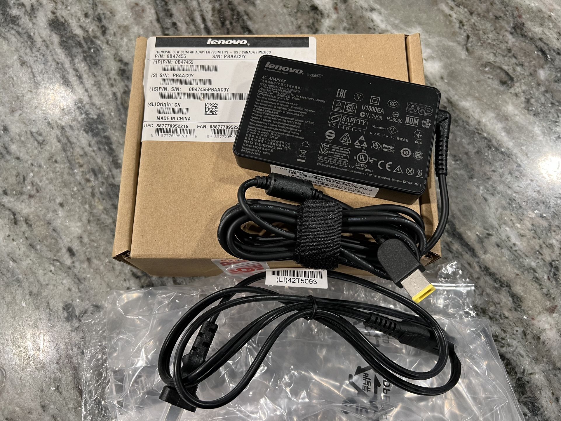 Lenovo 65W AC Adapter slim tip. P/N 0B47455. New. Sealed. Few available.