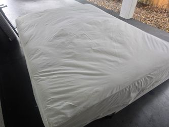 Queen size bed with boxspring base.