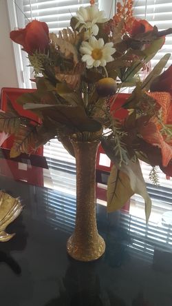 Gold vase with silky flowers