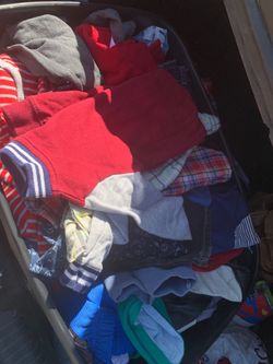 Bin full of baby boy clothes