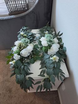 Flowers can fit on wine barrels or welcome or seating charts
