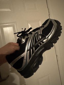 Black and silver Nike moto 2k