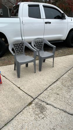 Two Gray Plastic Chairs Take Both For 10