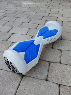 6.5 inch smart self balancing hoverboard. Solid rubber tires, sleek modern design. Working good. No charger