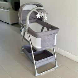 Bedside Bassinet Portable Crib With Activity Mobile, Arm With Nightlight, Rotating Stars Size 33”Lx 46”Hx 20” W Color Grey Tweed Like New
