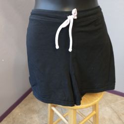Cascade sports large black athletic shorts with pink and white stripes on sides

